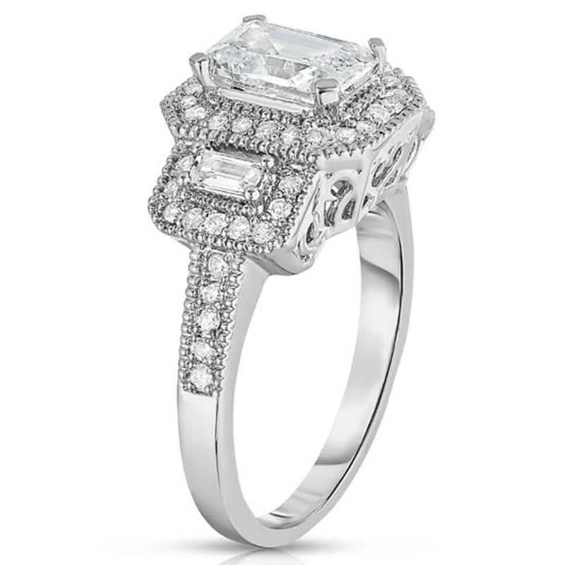 Anillo de oro blanco de 18k con tres piedras de circonita cúbica talla esmeralda
