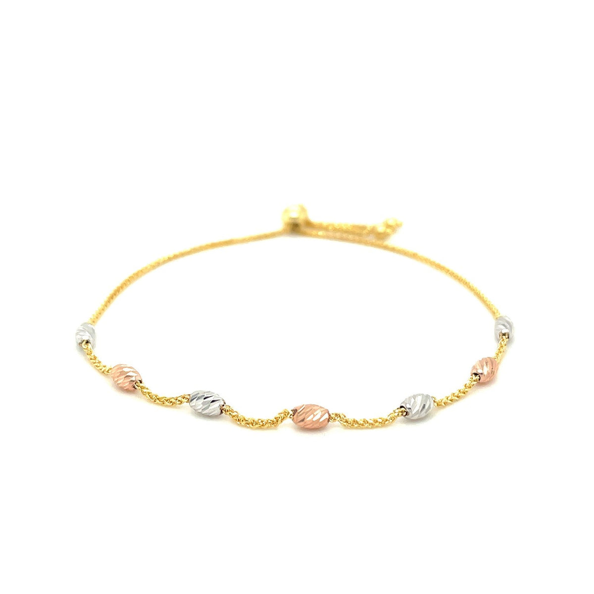 Pulsera estilo lariat con estaciones ovaladas texturizadas en oro tricolor de 14k