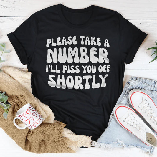 "Please Take A Number I'll Piss You Off Shortly" – Relatable Sarcasm Graphic Shirt